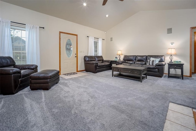 carpeted living room with vaulted ceiling, baseboards, and a ceiling fan