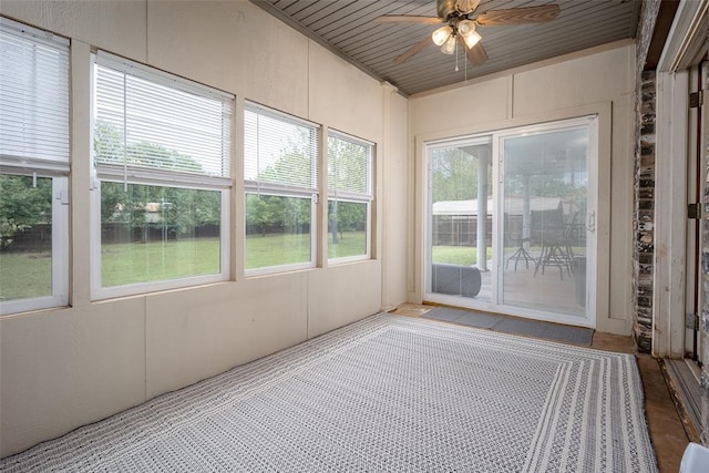 unfurnished sunroom featuring wood ceiling