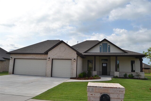 1124 NW 17 Th Pl, Newcastle, OK 73065 - view of front of house with brick siding, a garage, covered porch, and concrete driveway