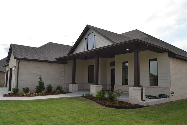 1124 NW 17 Th Pl, Newcastle, OK 73065 - view of home's exterior featuring a garage, brick siding, a shingled roof, a porch, and a yard