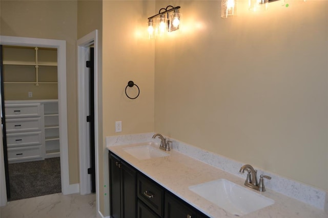 1124 NW 17 Th Pl, Newcastle, OK 73065 - bathroom with double vanity, a sink, marble finish floor, and baseboards