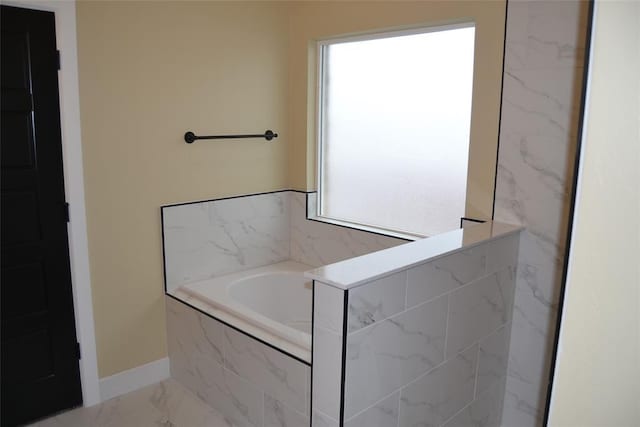 1124 NW 17 Th Pl, Newcastle, OK 73065 - bathroom with marble finish floor, baseboards, and a bath