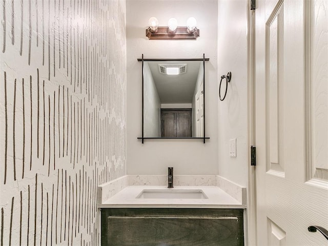 bathroom featuring visible vents and vanity
