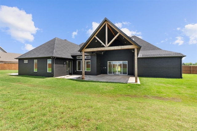 1233 Collis Ct, Newcastle, OK 73065 - back of property with a patio area, brick siding, and a shingled roof
