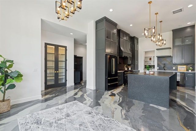 1233 Collis Ct, Newcastle, OK 73065 - kitchen with a chandelier, freestanding refrigerator, marble tiled floors, recessed lighting, and french doors