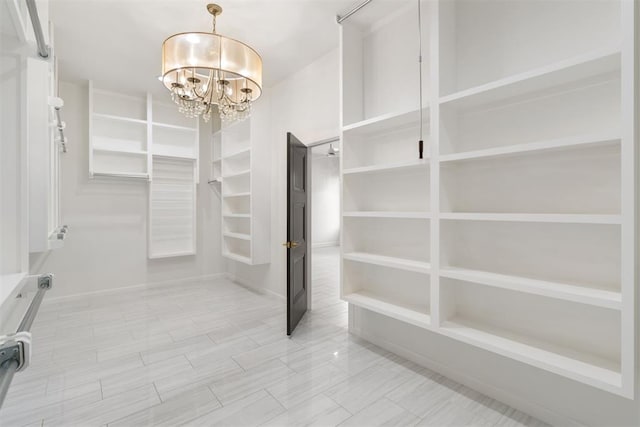 1233 Collis Ct, Newcastle, OK 73065 - walk in closet featuring a chandelier