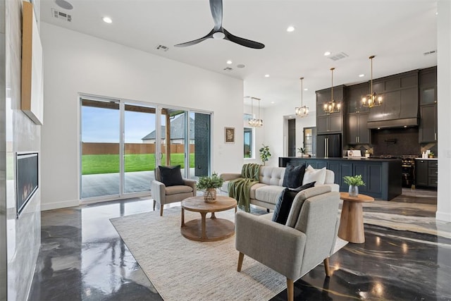 1233 Collis Ct, Newcastle, OK 73065 - living room with recessed lighting, a ceiling fan, and a chandelier