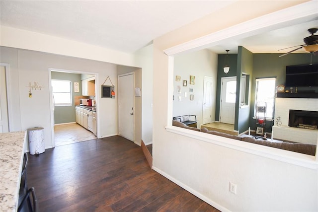 interior space with dark wood finished floors and baseboards