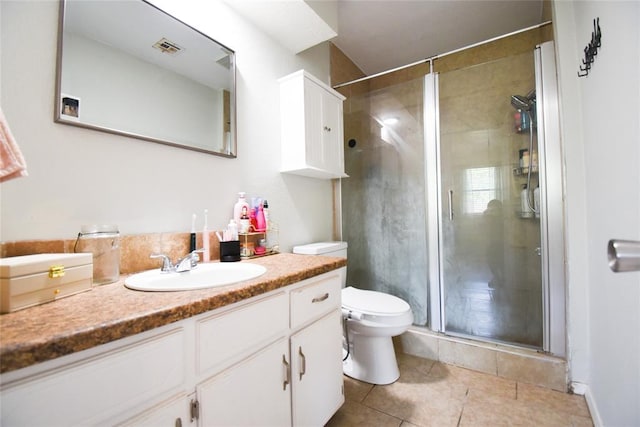 full bath with visible vents, a stall shower, toilet, tile patterned floors, and vanity