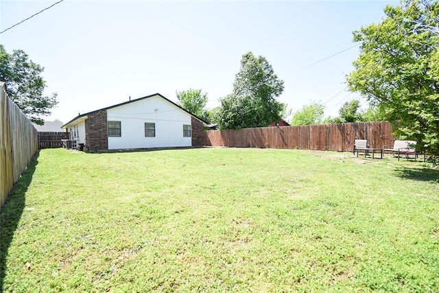 view of yard featuring a fenced backyard