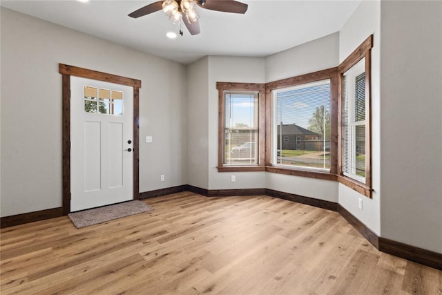 foyer entrance with recessed lighting, light wood-style floors, a ceiling fan, and baseboards