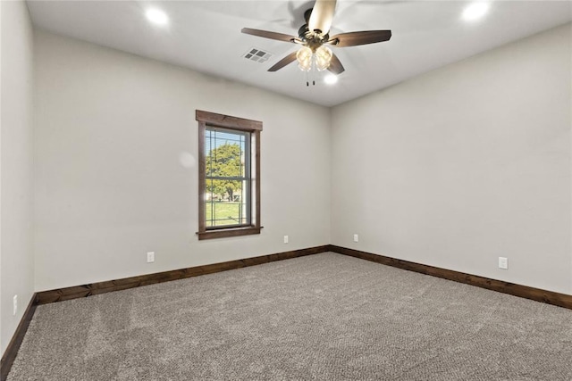 spare room featuring recessed lighting, carpet, visible vents, and baseboards