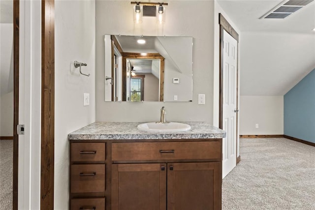bathroom featuring baseboards, visible vents, and vanity