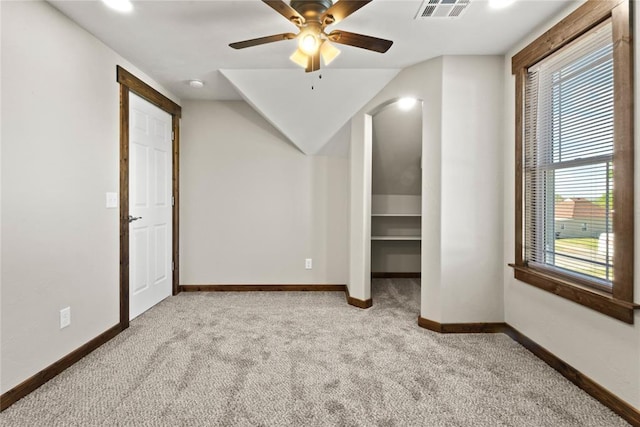bonus room featuring carpet, visible vents, a ceiling fan, a healthy amount of sunlight, and baseboards