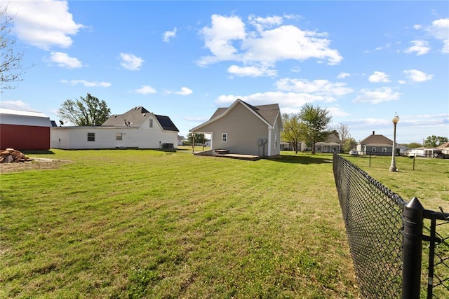 view of yard with a residential view and fence