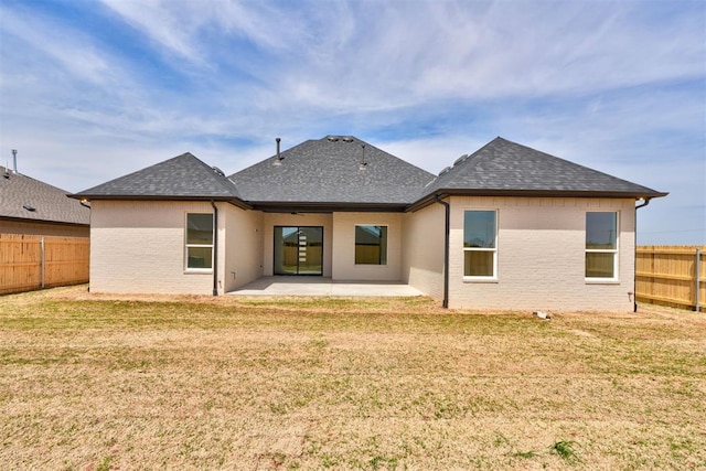 6508 NW 146th St, Oklahoma City, OK 73142 - rear view of property featuring a lawn, a patio area, a fenced backyard, and roof with shingles