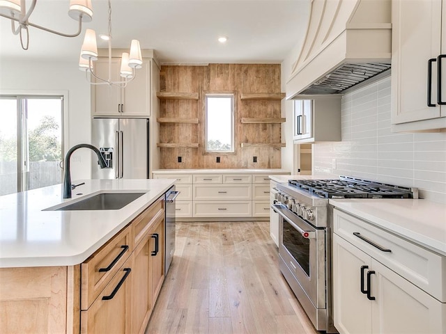 kitchen featuring high end appliances, decorative backsplash, open shelves, a sink, and premium range hood