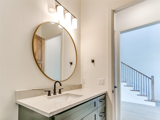 bathroom featuring vanity and wood finished floors