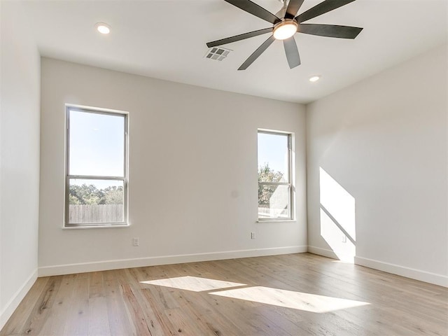 empty room featuring visible vents, baseboards, light wood-type flooring, recessed lighting, and a ceiling fan