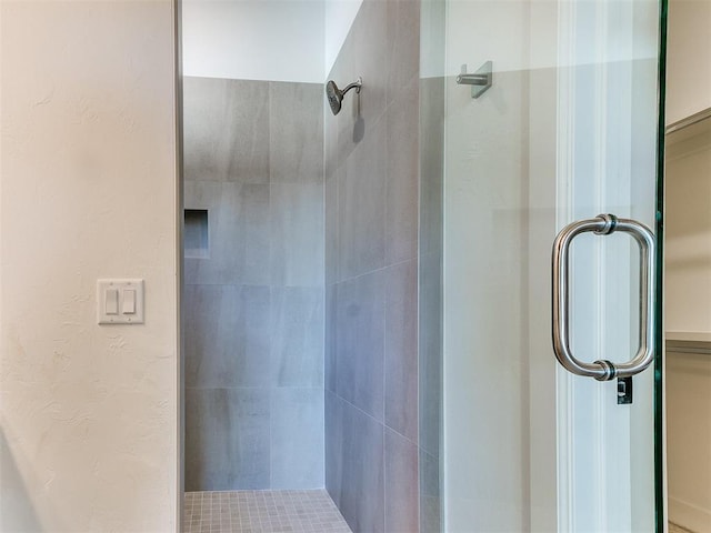 full bath featuring a shower stall