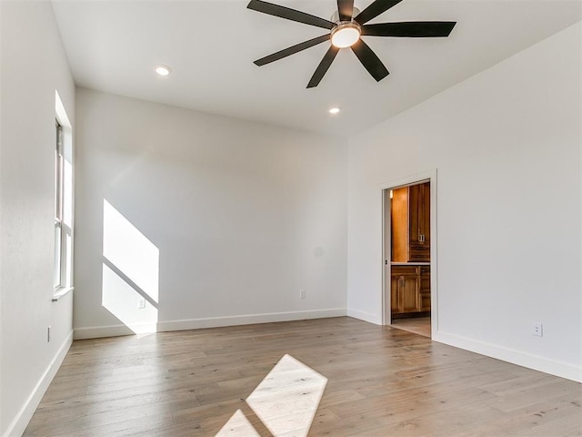 unfurnished room with ceiling fan, recessed lighting, light wood-style flooring, and baseboards