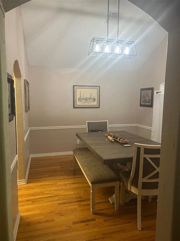 501 S 7th St, Okemah, OK 74859 - dining room featuring lofted ceiling and light wood-style floors