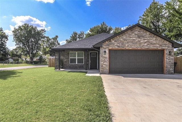 1717 Breckenridge Dr, Oklahoma City, OK 73115 - single story home with a garage, concrete driveway, fence, a front yard, and brick siding