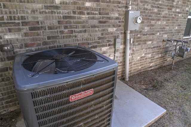 1717 Breckenridge Dr, Oklahoma City, OK 73115 - exterior details featuring central AC unit, brick siding, electric meter, and gas meter
