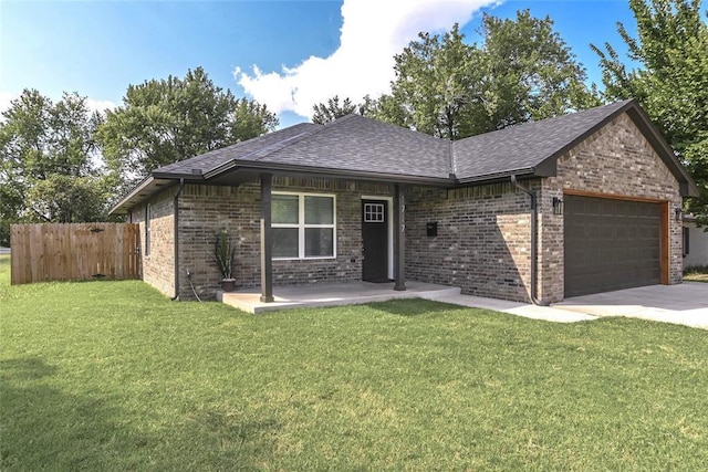 1717 Breckenridge Dr, Oklahoma City, OK 73115 - ranch-style home featuring fence, a shingled roof, brick siding, a front yard, and a garage