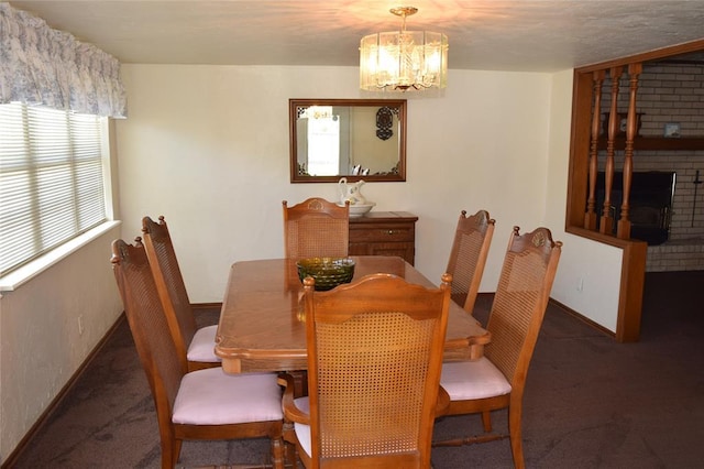 1400 S Indian Meridian Rd, Choctaw, OK 73020 - dining area with an inviting chandelier, baseboards, a brick fireplace, and carpet