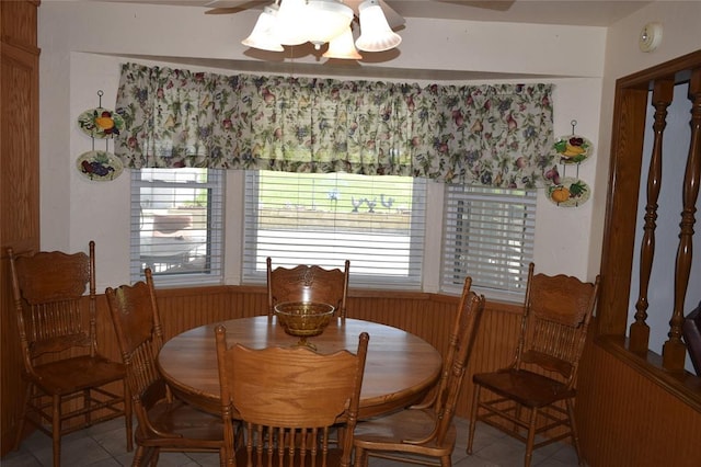 1400 S Indian Meridian Rd, Choctaw, OK 73020 - dining room featuring a ceiling fan, tile patterned floors, and wooden walls