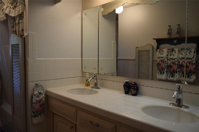 1400 S Indian Meridian Rd, Choctaw, OK 73020 - bathroom with double vanity, wainscoting, and a sink