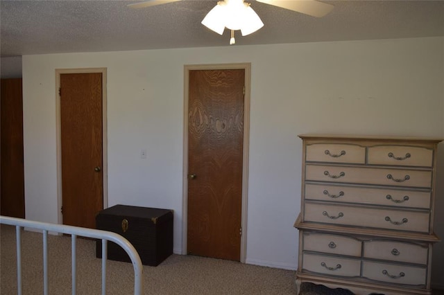 1400 S Indian Meridian Rd, Choctaw, OK 73020 - bedroom with light colored carpet, ceiling fan, baseboards, and a textured ceiling
