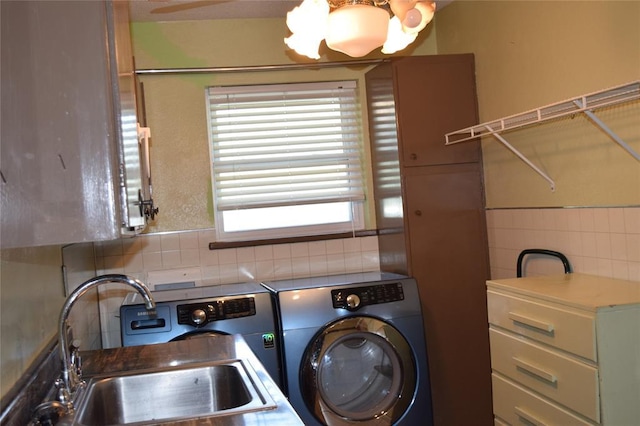 1400 S Indian Meridian Rd, Choctaw, OK 73020 - laundry area featuring a sink, tile walls, a chandelier, washer and dryer, and laundry area