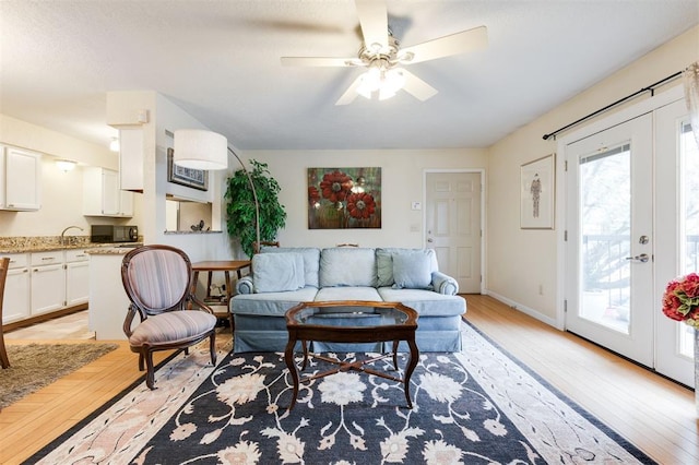 3200 W Britton Rd Unit 232, Oklahoma City, OK 73120 - living area featuring light wood finished floors and a ceiling fan