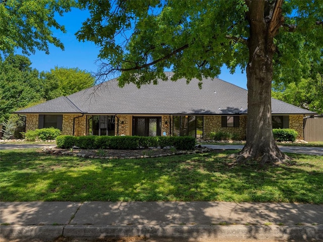 3025 Pine Ridge Rd, Oklahoma City, OK 73120 - ranch-style home with stone siding and a front yard