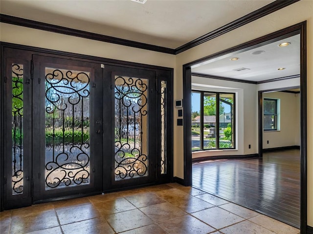 3025 Pine Ridge Rd, Oklahoma City, OK 73120 - foyer entrance featuring stone tile flooring, french doors, baseboards, and ornamental molding