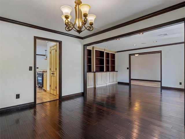 3025 Pine Ridge Rd, Oklahoma City, OK 73120 - unfurnished room with baseboards, a notable chandelier, wood finished floors, and visible vents