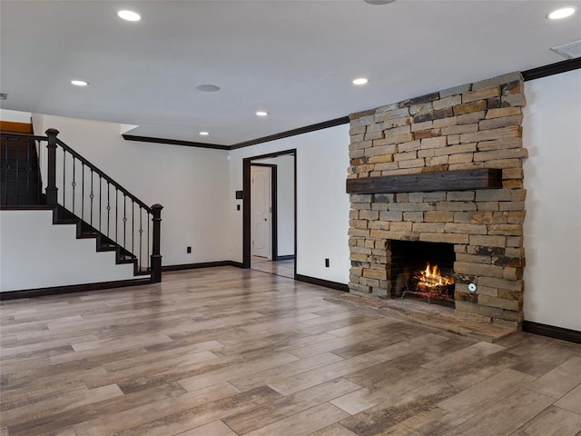 3025 Pine Ridge Rd, Oklahoma City, OK 73120 - unfurnished living room with wood finished floors, ornamental molding, baseboards, a fireplace, and stairs