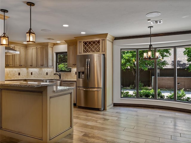 3025 Pine Ridge Rd, Oklahoma City, OK 73120 - kitchen featuring light stone countertops, stainless steel appliances, light wood-style flooring, and a healthy amount of sunlight