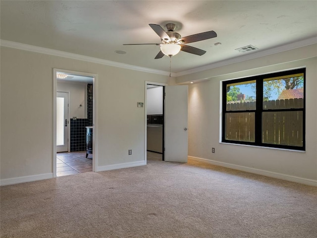 3025 Pine Ridge Rd, Oklahoma City, OK 73120 - unfurnished bedroom featuring visible vents, crown molding, baseboards, and light carpet