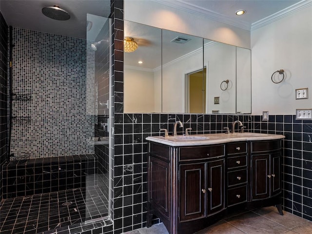 3025 Pine Ridge Rd, Oklahoma City, OK 73120 - bathroom with tile patterned floors, a sink, tile walls, double vanity, and a walk in shower