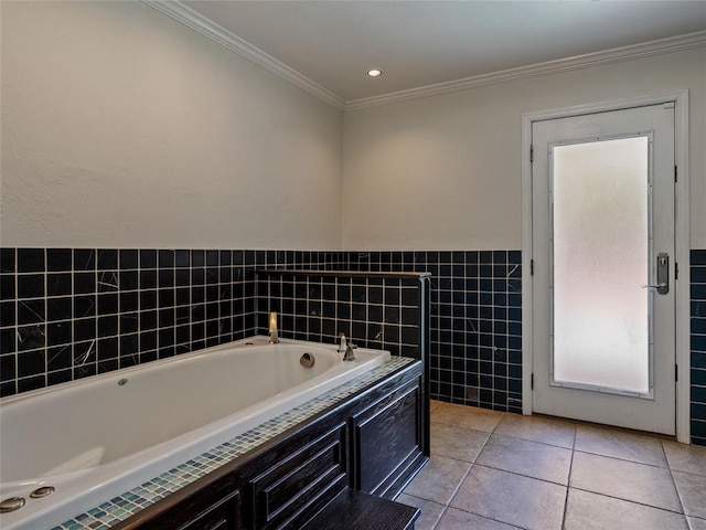 3025 Pine Ridge Rd, Oklahoma City, OK 73120 - bathroom featuring a wainscoted wall, tile patterned floors, tile walls, crown molding, and a garden tub