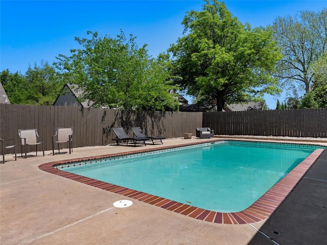 3025 Pine Ridge Rd, Oklahoma City, OK 73120 - view of swimming pool with a patio area, a fenced backyard, and a fenced in pool
