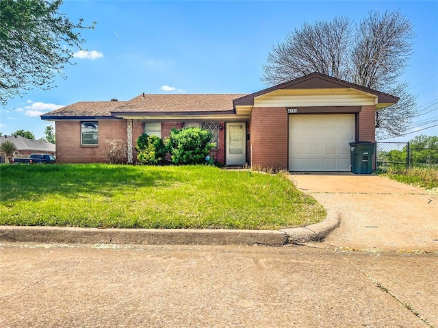 4753 SE 19th St, Oklahoma City, OK 73115 - single story home featuring brick siding, an attached garage, and driveway