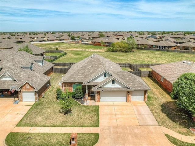 birds eye view of property with a residential view