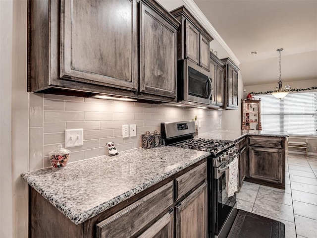 kitchen featuring a peninsula, dark brown cabinetry, appliances with stainless steel finishes, and tasteful backsplash
