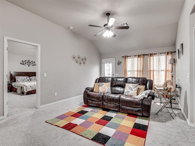 living room featuring ceiling fan, baseboards, light colored carpet, lofted ceiling, and visible vents