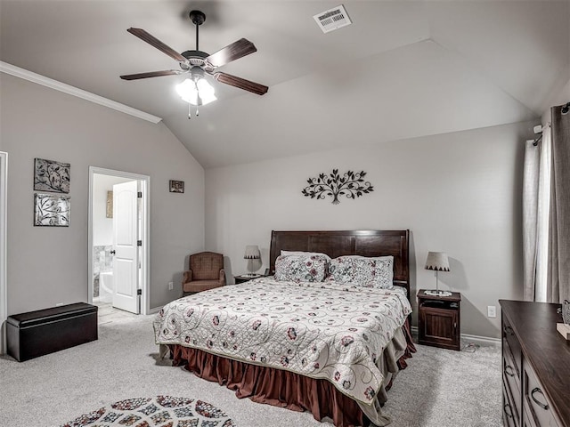 bedroom featuring lofted ceiling, visible vents, baseboards, and light carpet