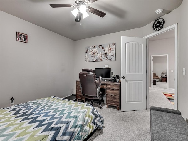 bedroom with ceiling fan and light colored carpet